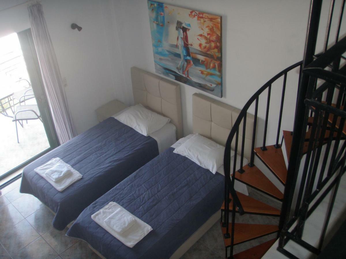 Umbrella Beach Apartments Kavos Bagian luar foto
